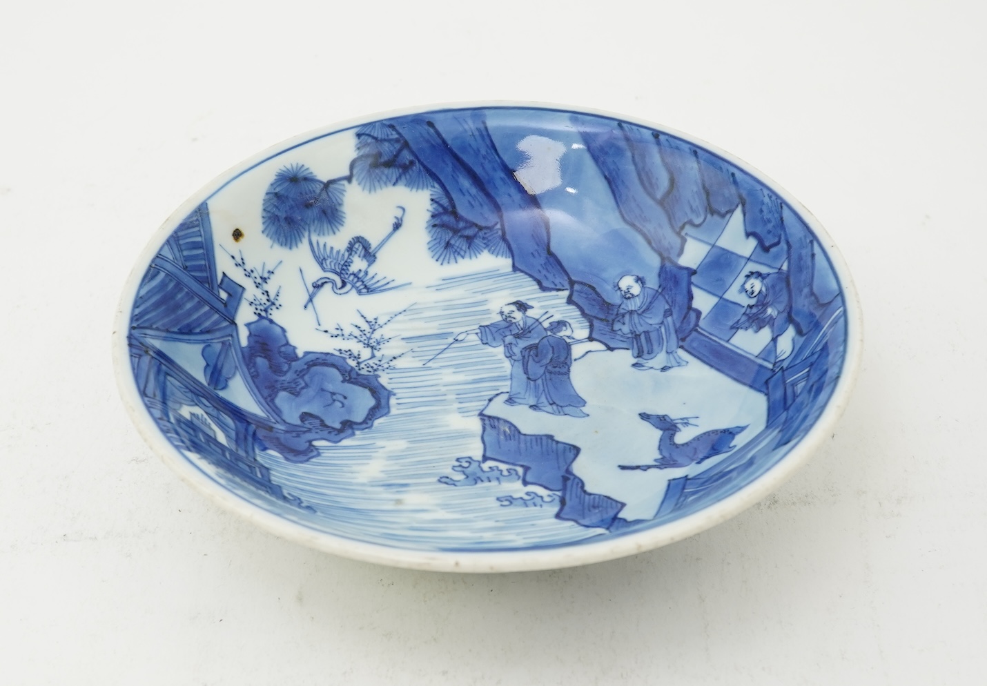 A Chinese blue and white saucer dish, Kangxi six character mark and of the period (1662-1722)